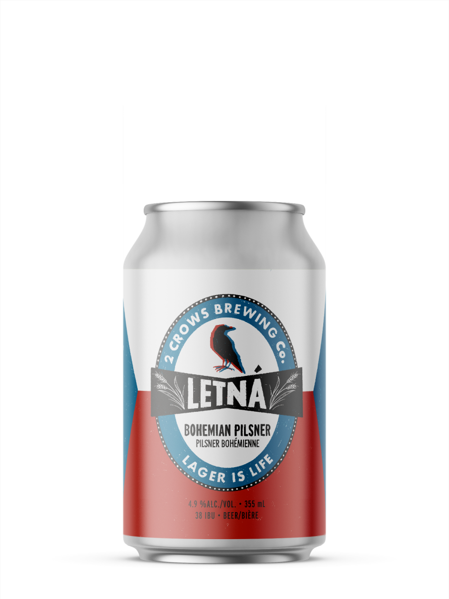 A single short can of our Letná beer, the label looks more typical but rustically inspired by traditional lagers. There is an oval emblem around the 2crows logo with wheat sprouting out a ribbon running through the middle.