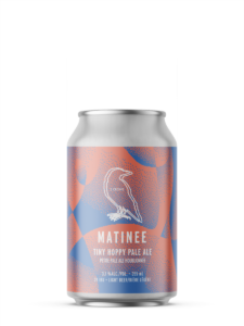A single short can of our Matinee beer, the label is pink orange with dotted fading shapes of muted blue.